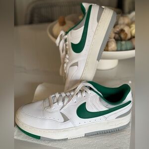 Nike sneakers with green Nike emblem